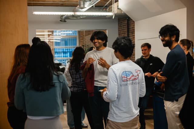 Fellows socializing at an Aristotle event