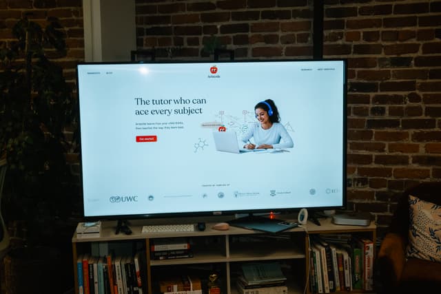 Aristotle website displayed on a TV screen